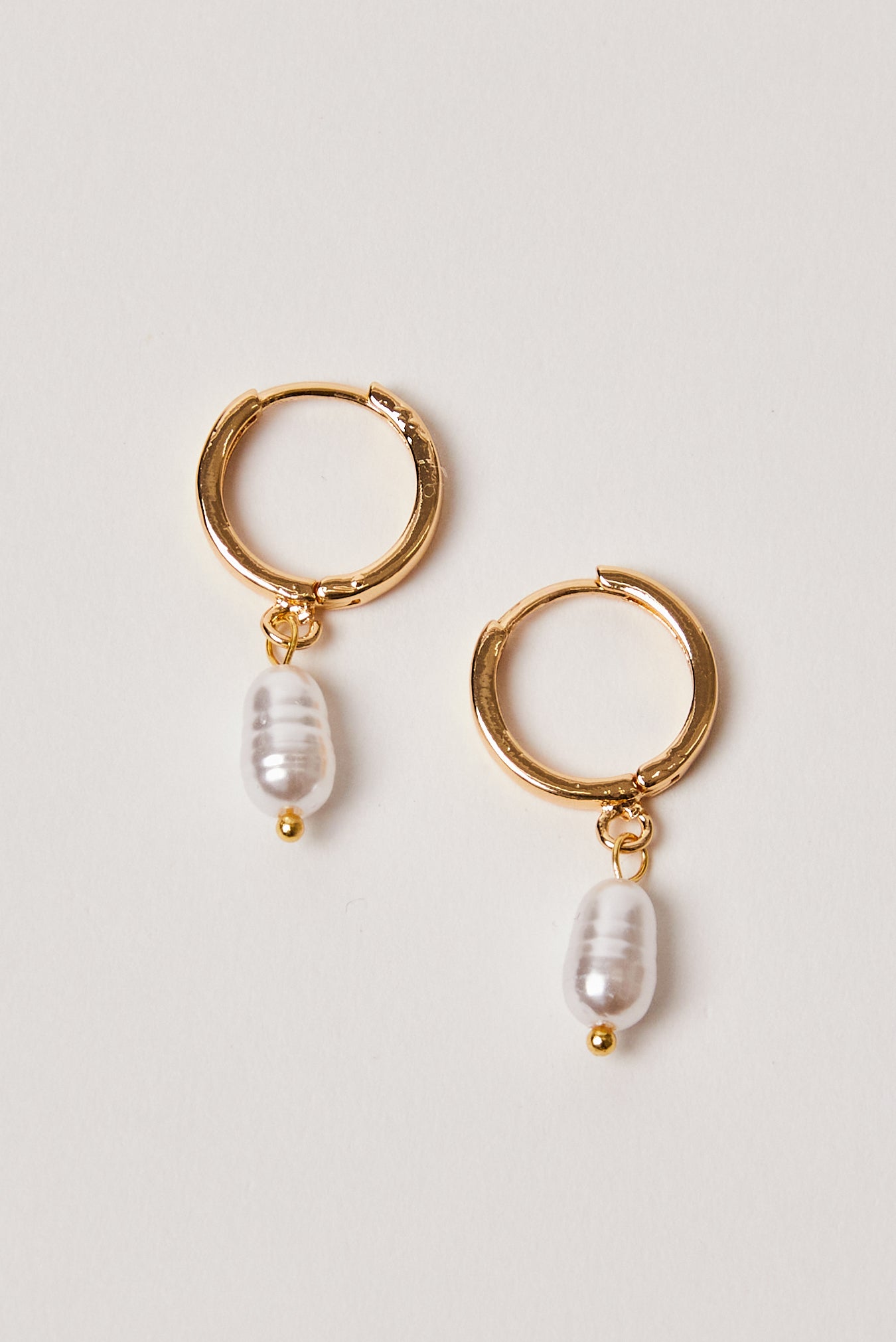 Uneven hot sale pearl earrings